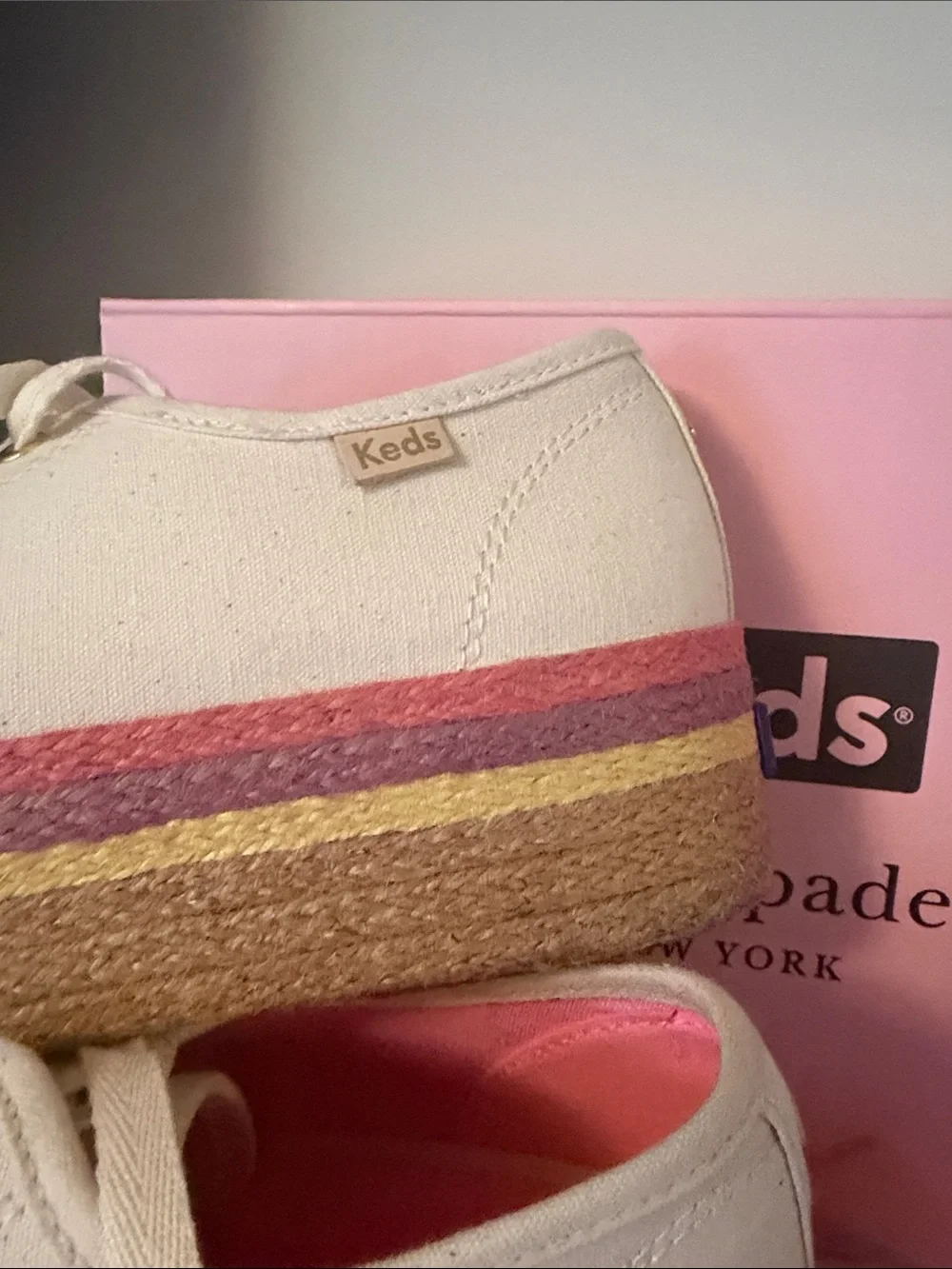 kate spade cream canvas platform sneakers with pink and gold accents